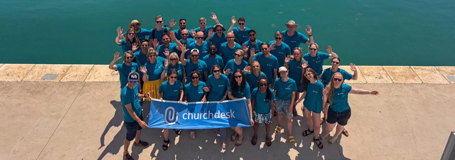 The ChurchDesk team gathered on a jetty